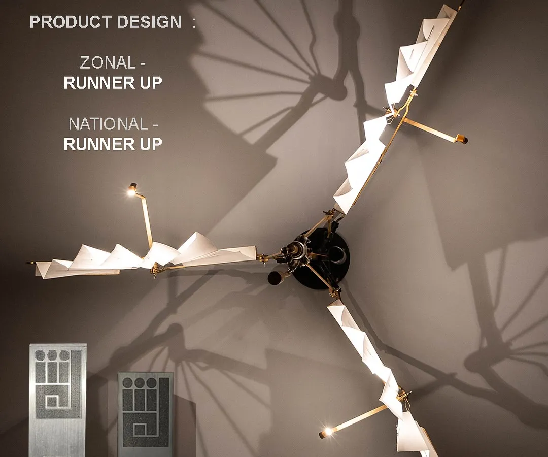 Our award-winning kinetic dining light, 'ScioNara'. This piece is a work of product design that functions as both a light source and a dynamic sculpture. Its articulated arms shift and fold, casting ephemeral shadows that continually transform the dining space.
