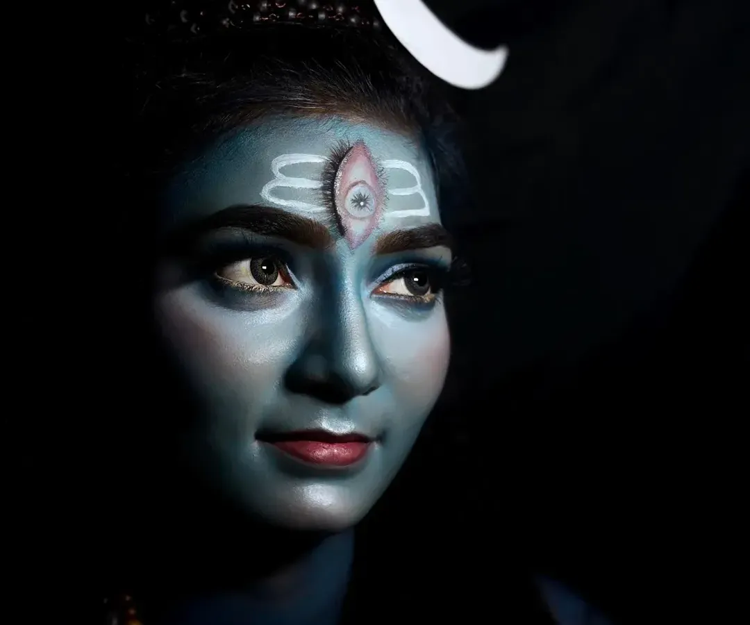 This is my artistic tribute to Lord Shiva, created using professional body paint and dramatic lighting. The look focuses on capturing a divine essence, complete with the iconic third eye and crescent moon, perfect for mythological photoshoots or themed events.
