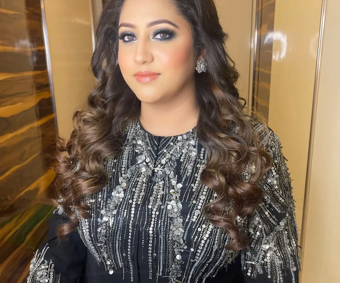This is my signature cocktail glam, featuring a beautifully blended smokey eye that makes the eyes pop. I paired it with a soft nude lip and glowing skin to complete this stunning evening look.