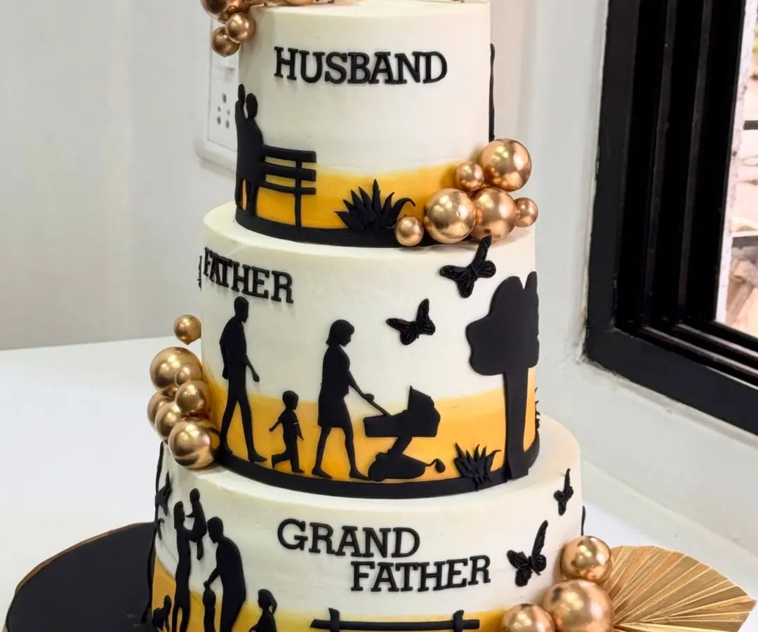 A cake that tells a lifetime's story. Each tier of this 75th birthday cake represents a cherished role: Husband, Father, and Grandfather, celebrating a beautiful legacy of family and love.