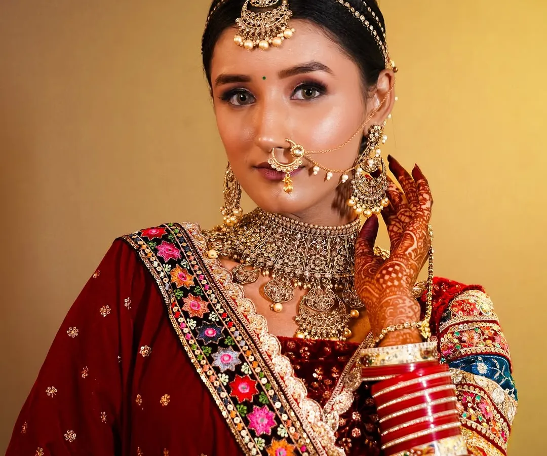 This is the kind of professional, high-quality photo my students create for their portfolio. A perfect traditional bridal makeup look that shows their skill.