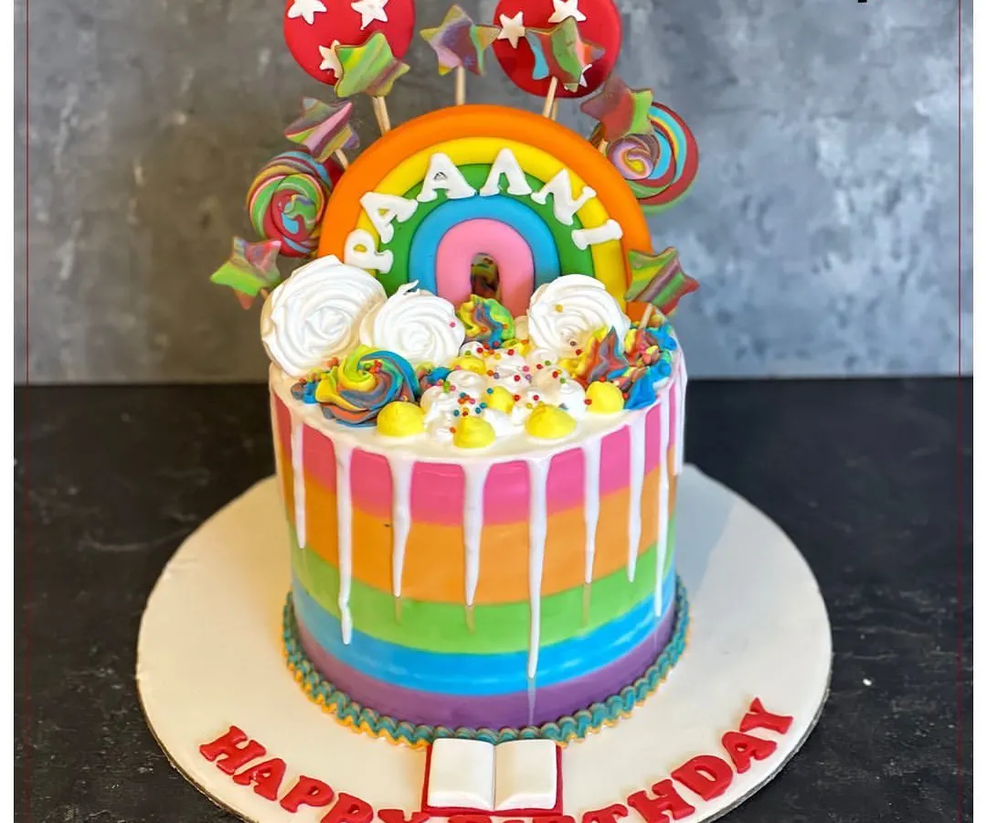 We love making birthdays extra bright with cakes like this rainbow drip design. It’s packed with fun details like lollipops and sprinkles, showing how we can turn any kid's birthday party into a colorful, sweet celebration.