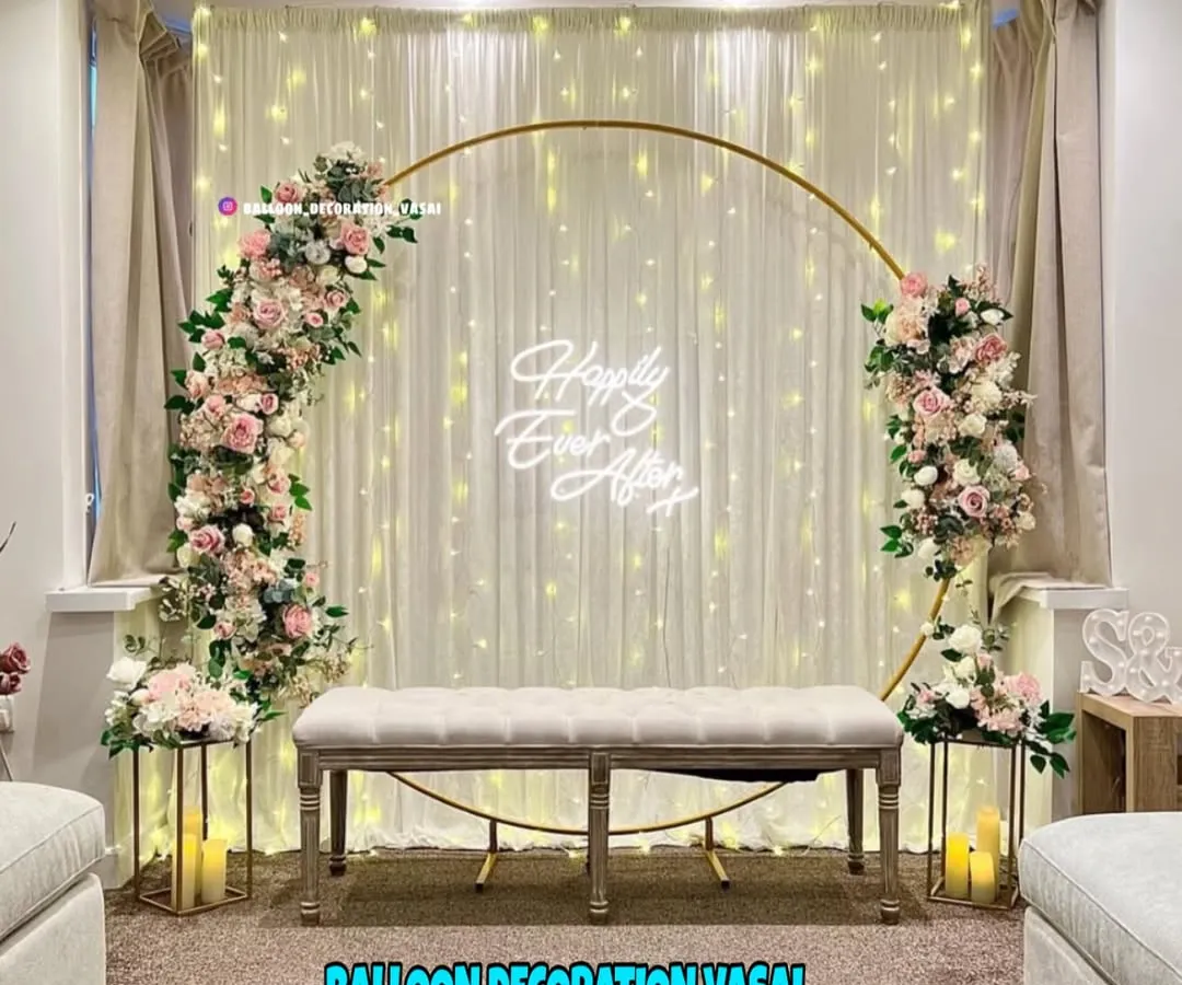 This popular golden ring arch is a favorite for engagement parties. We adorn it with soft florals and a custom neon sign to create a fairytale backdrop for your photos.