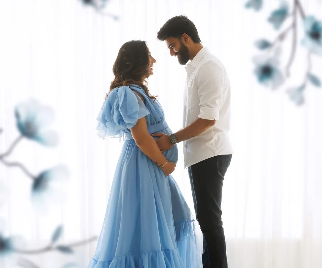 Awaiting a new beginning in a loving embrace. This ethereal maternity portrait captures the quiet, intimate connection between partners during this beautiful journey.