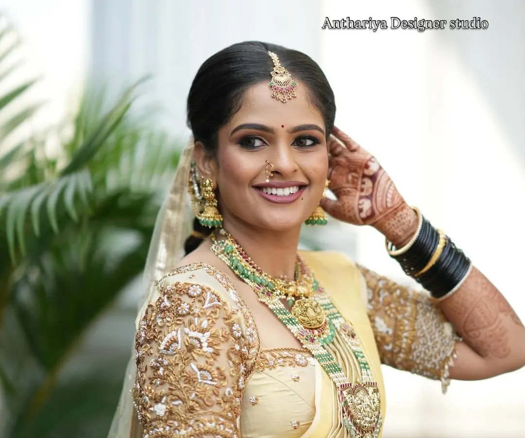 Seeing our bride Monisha glowing with happiness is why I do what I do. We designed this custom golden Kanjivaram blouse to match her wedding saree, focusing on heavy embroidery to create a look of pure grace.