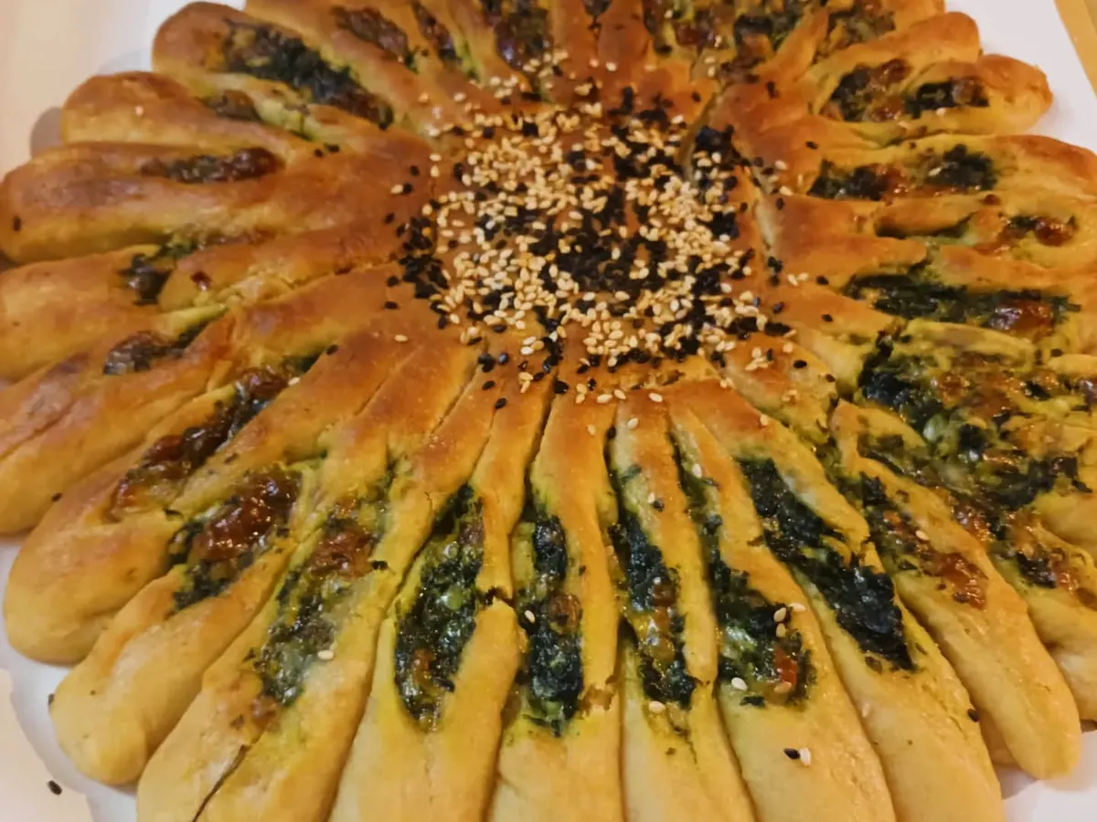 This is my gluten-free Millet Sunflower Bread, filled with a savory spinach and vegan cheese mixture. It's a beautiful centerpiece that proves healthy baking can be both artistic and incredibly satisfying.