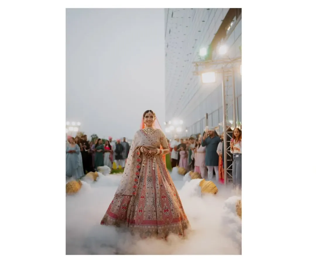 The bride's entrance is a moment suspended in time. I used a low-angle shot with theatrical smoke to create this ethereal, almost magical atmosphere, making her look like she's floating toward her future. It’s about making the grand moments feel deeply personal and unforgettable.