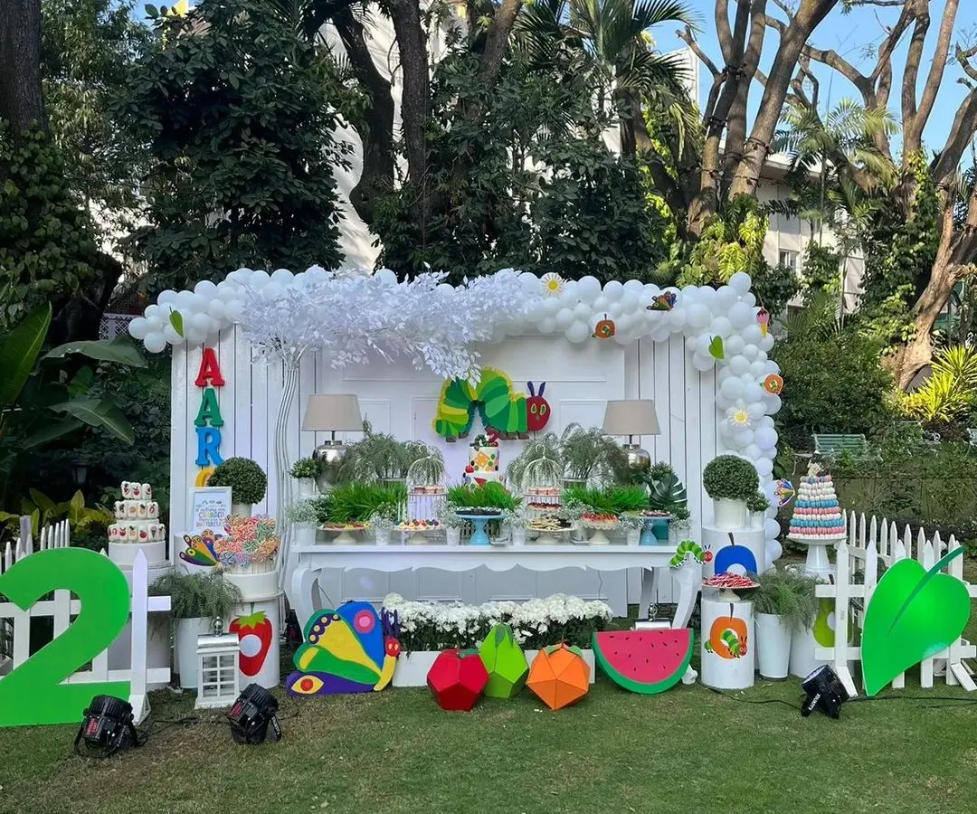I transformed this outdoor space into a vibrant world based on 'The Hungry Caterpillar' for a second birthday. This full event setup shows how I combine large props, a themed dessert table, and personalized details to create a completely immersive experience for your child.