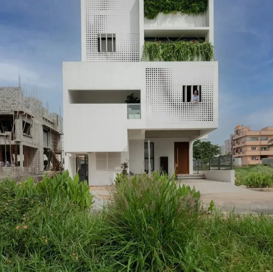 The LUCID House showcases our approach to urban residential architecture on a compact site. A dynamic, perforated metal screen on the facade provides privacy while allowing filtered light to create shifting patterns within the home throughout the day.