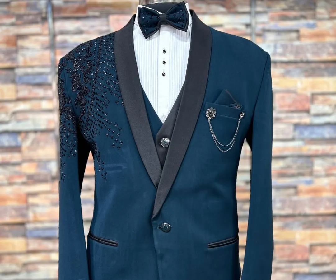 A complete look for the modern man. This five-piece Indo-Western suit in a sharp teal blue is perfect for a reception or engagement party. The rental includes the embellished jacket, waistcoat, shirt, trousers, and a matching bow tie.