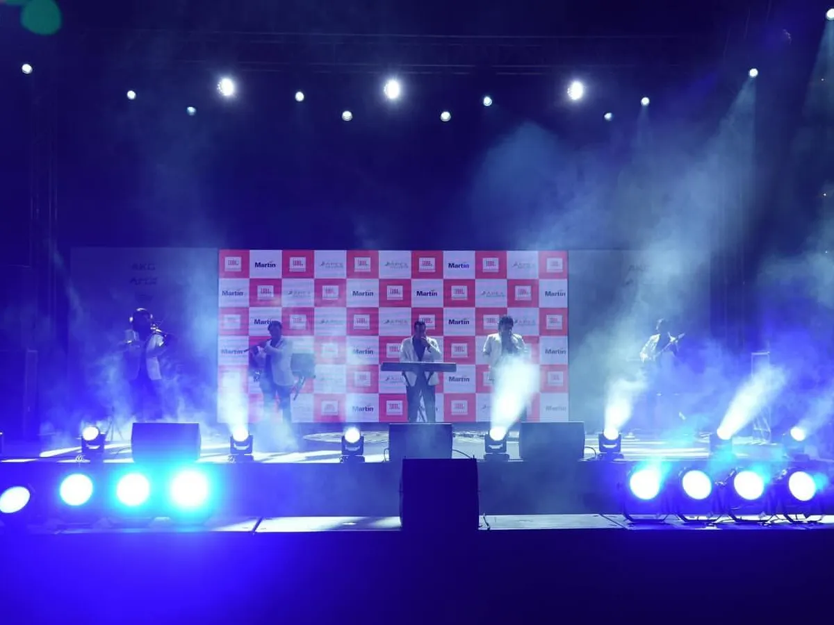 Creating an electric atmosphere for a live music performance at a corporate brand event. Our stage lighting design uses dynamic beams and atmospheric smoke to immerse the audience and put the artists in the spotlight.