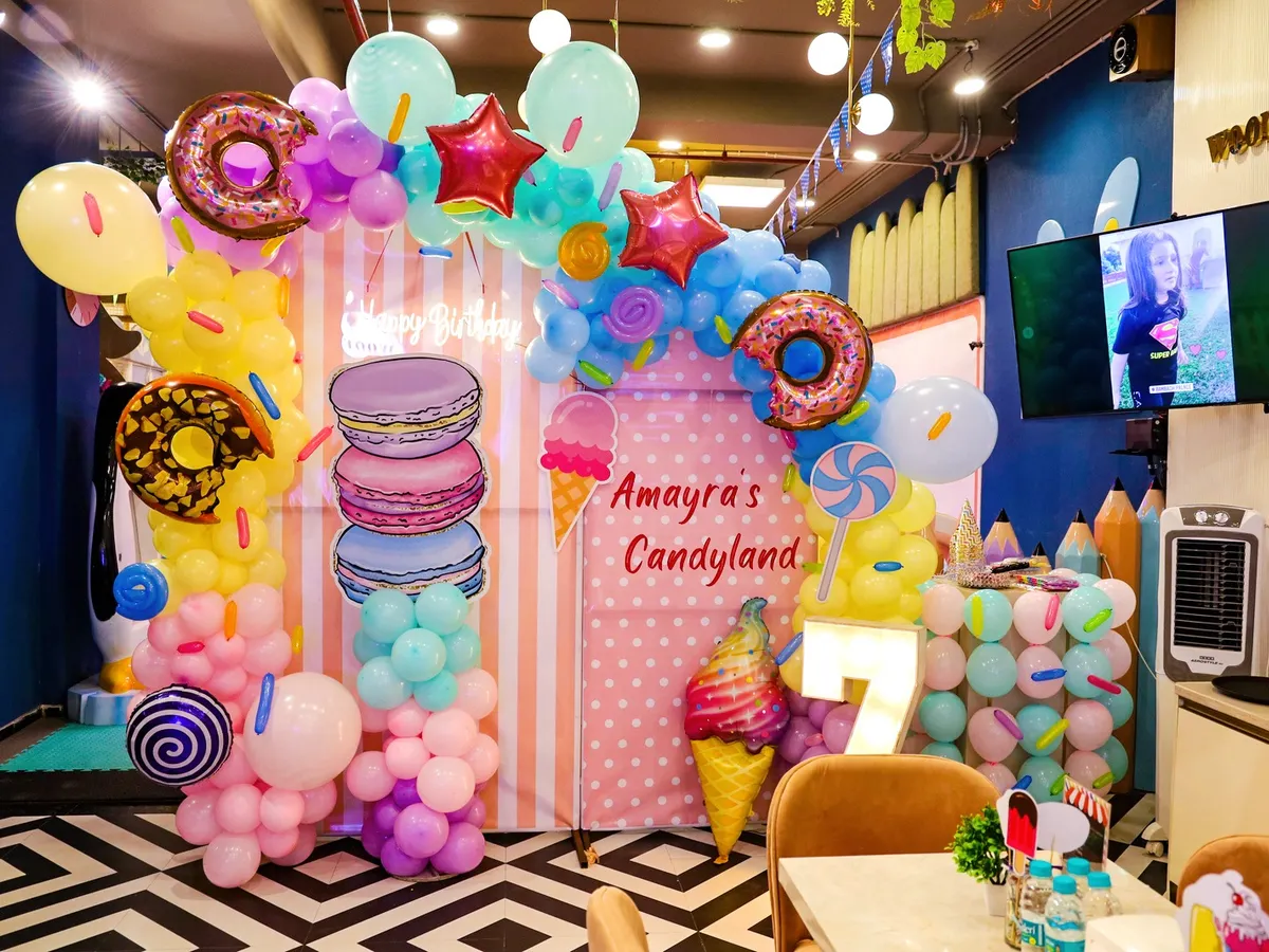 We brought a child's sweet dream to life with this incredible "Candyland" theme. Featuring giant macarons, ice cream cones, and donut balloon arches, our themed party decorations transform the space into a whimsical paradise.