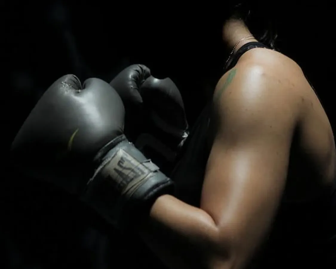 The focus, the power, the release. Our boxing and combat sports training is more than just a workout; it's a discipline that builds mental and physical strength. This shot captures the intensity and empowerment our members feel.