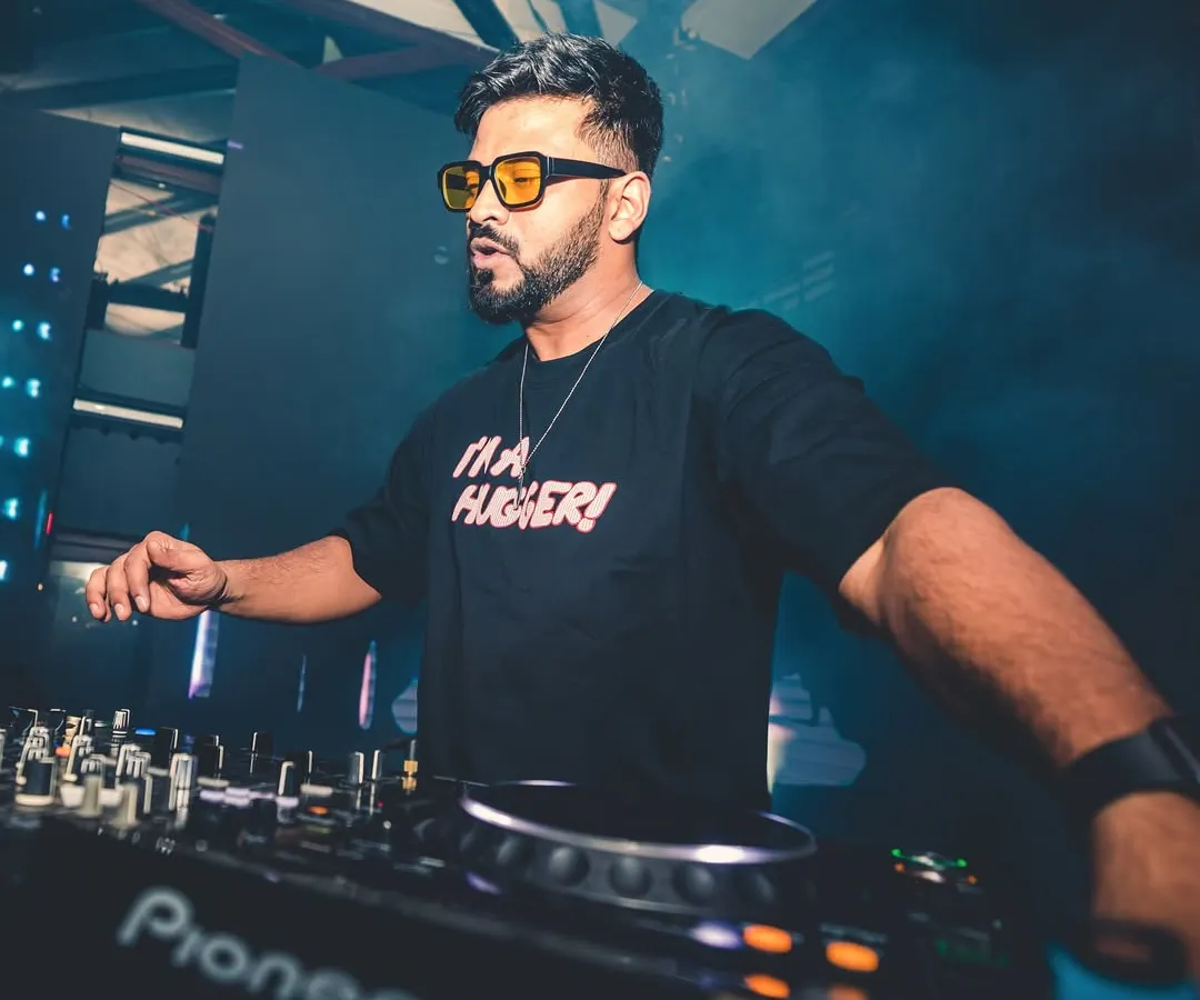 In the zone, mixing tracks at the console. This is where I blend my love for Bollywood with deep house and techno, creating a sound that's completely my own.