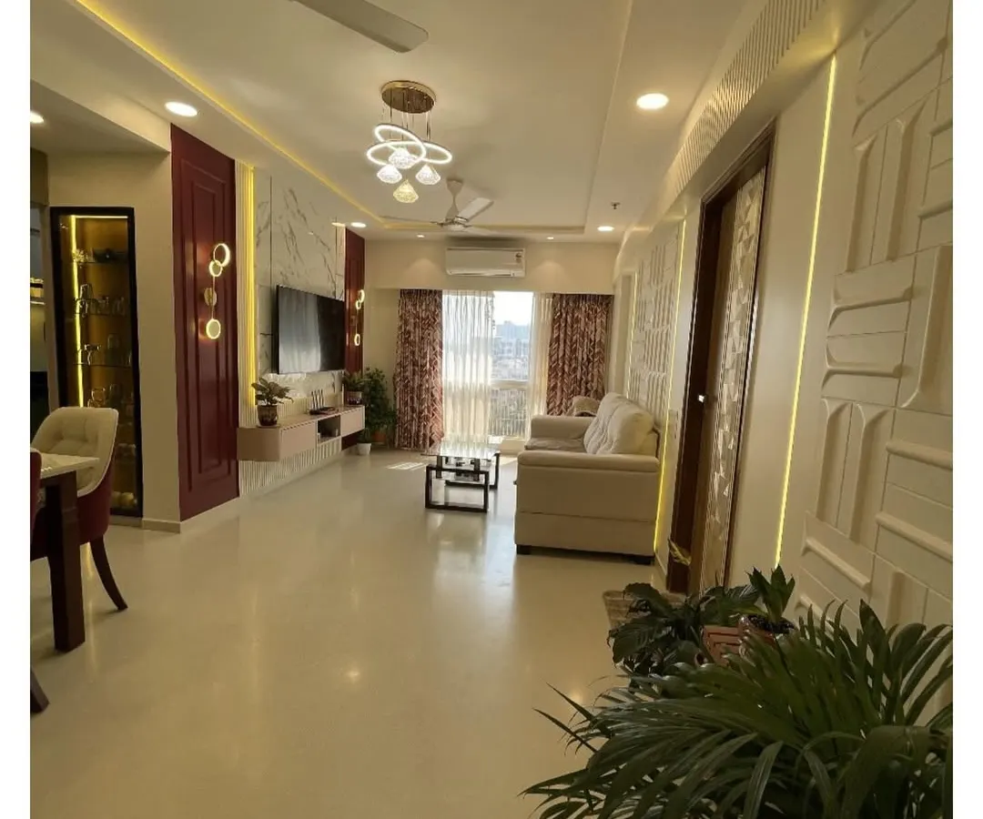 I design open, flowing spaces where life can unfold beautifully. This expansive living and dining area combines modern luxury with comfortable living, featuring a rich color palette, statement lighting, and custom wall textures to create a truly impressive and welcoming atmosphere.