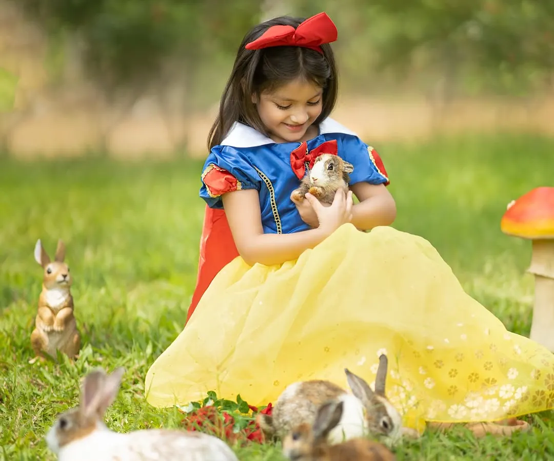 We create real-life fairy tales for your little ones. This Snow White session, complete with gentle bunny friends, was an absolute dream to photograph in a beautiful outdoor setting.