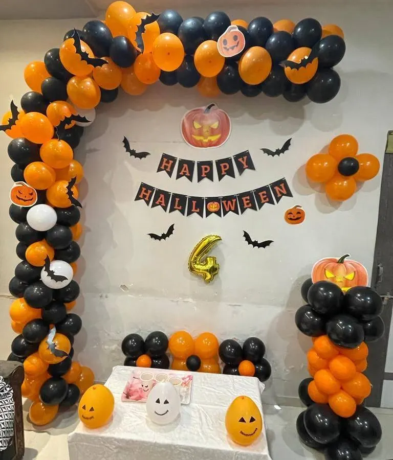 Our fun Halloween party setup, designed with a striking orange and black balloon arch. We included a 'Happy Halloween' banner, bat cutouts, and friendly pumpkin characters to create a festive and cheerful atmosphere for all ages.