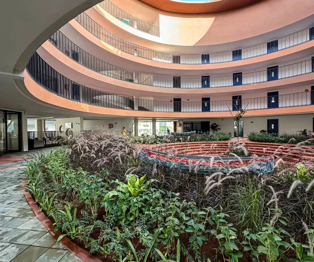 At the core of the school, a circular courtyard with lush, tiered gardens serves as a biophilic sanctuary. This space embodies our commitment to creating environments that foster community and connect occupants with nature, enhancing the daily learning experience.