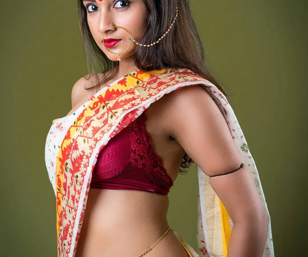 A modern take on traditional wear, this portrait features a woman in a stylishly draped saree against a bold green background. I focused on capturing a sense of liberation and confident femininity.