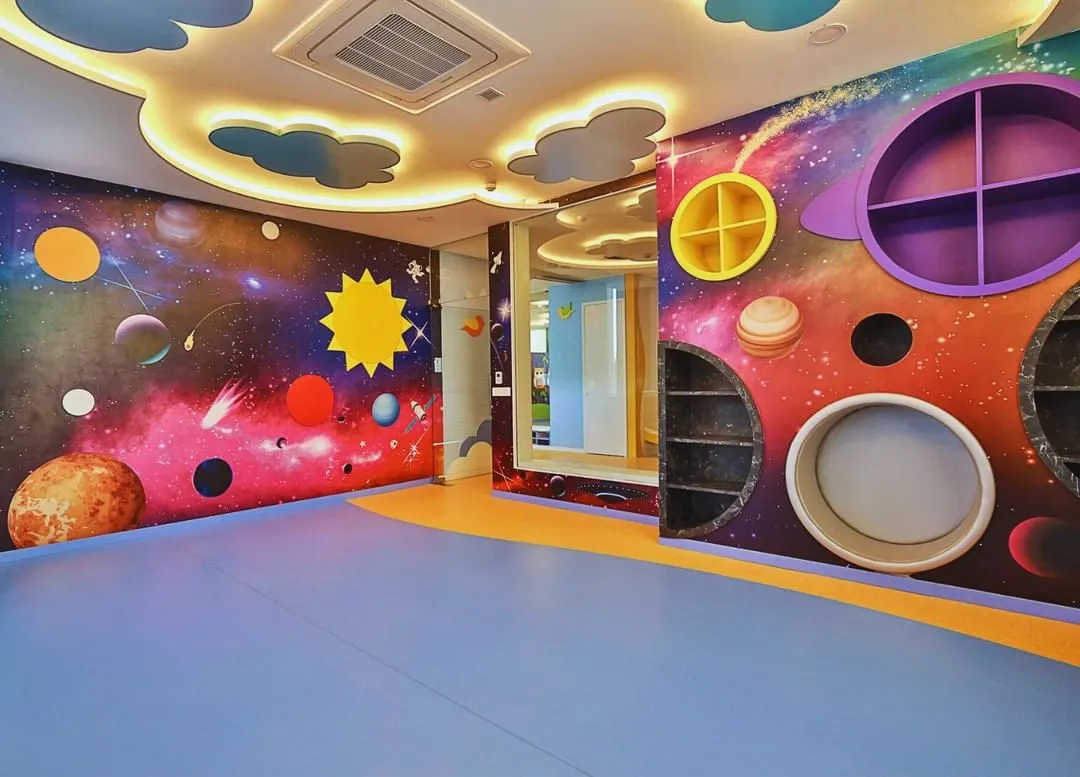 For the Supaksha Early Learning Habitat, we created a universe of imagination. This space-themed room features custom-built shelving and vibrant wall murals, designed to be an interactive and inspiring environment where children can learn and explore through play.