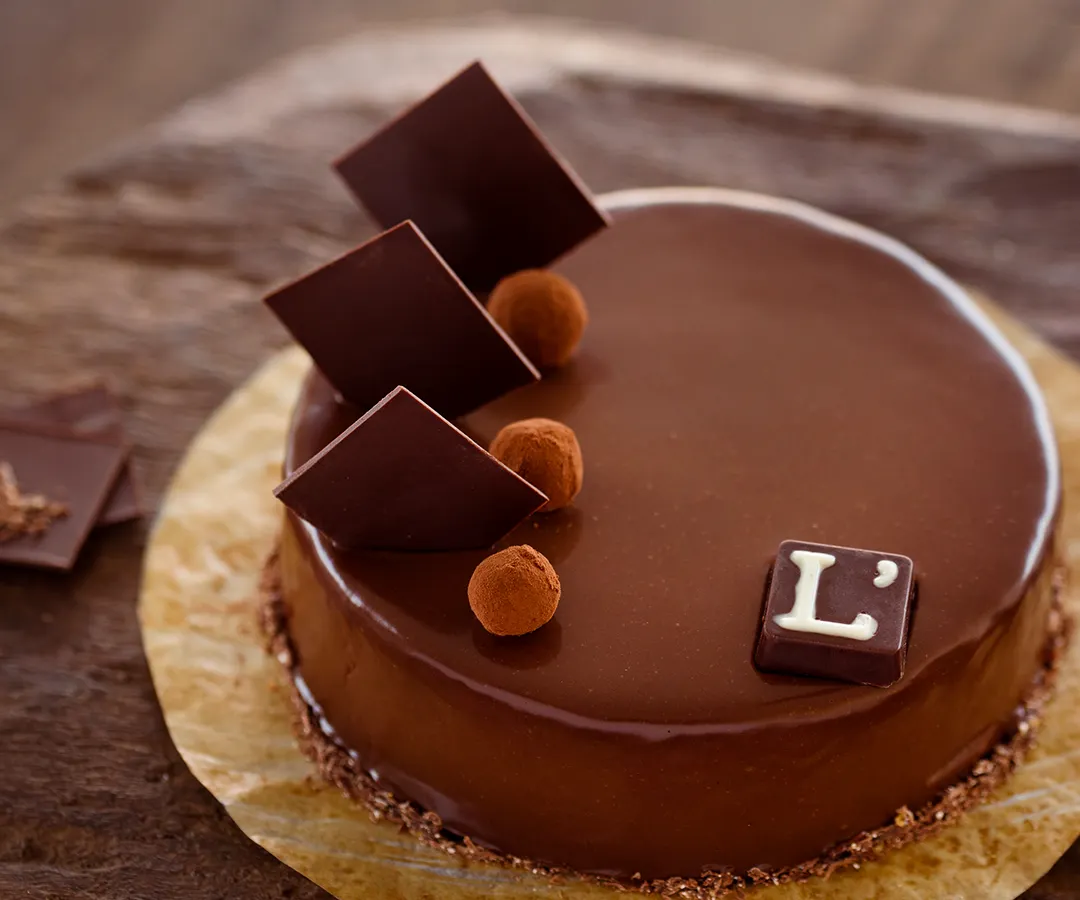 Behold our Belgian Truffle Cake, celebrated as one of the city’s finest. Crafted with rich, pure dairy cream and authentic Belgian chocolate, its glossy finish and deep flavour profile represent the pinnacle of our chocolate mastery.