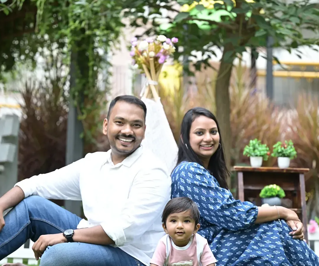 A perfect day for a family portrait outdoors. This session in a beautiful Bangalore park shows how natural light and a relaxed setting can bring out the most genuine smiles and happy moments between parents and their little one.