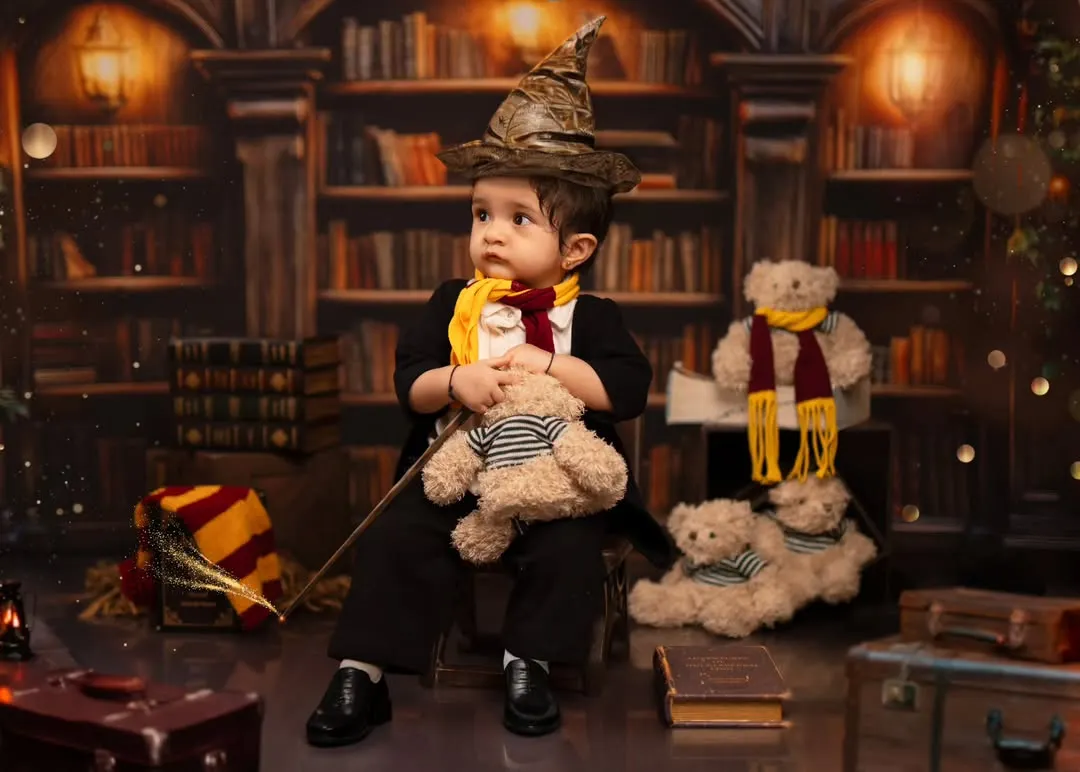 We bring magical worlds to life, like this Harry Potter themed toddler shoot. Our studio is equipped with detailed backdrops, costumes like the sorting hat and scarf, and props to create an authentic and enchanting experience for your little wizard.
