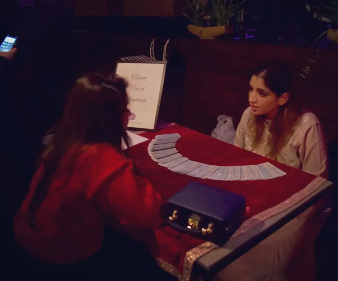 This is where the magic happens. A quiet moment during a private tarot reading, creating a safe space for my client to explore their questions and connect with the universe's guidance. Each session is a unique journey.