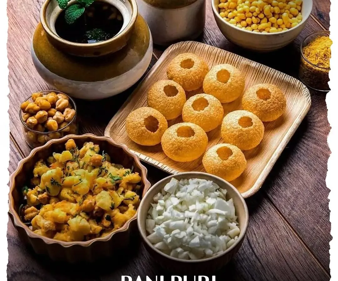 Nothing brings more energy to an event than a live chaat counter. Here is our classic Pani Puri station, meticulously arranged with all the fixings, promising a hygienic, fun, and flavorful bite every time.