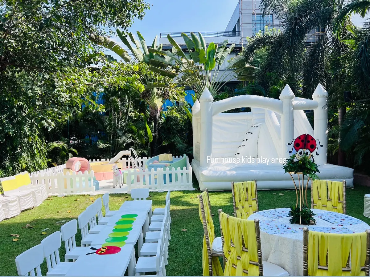 We can transform any garden into a complete kids' fun zone. This setup features our popular all-white bouncy castle, a safe soft play area, and clean, white child-sized tables and chairs, perfect for a stylish and fun-filled birthday party.