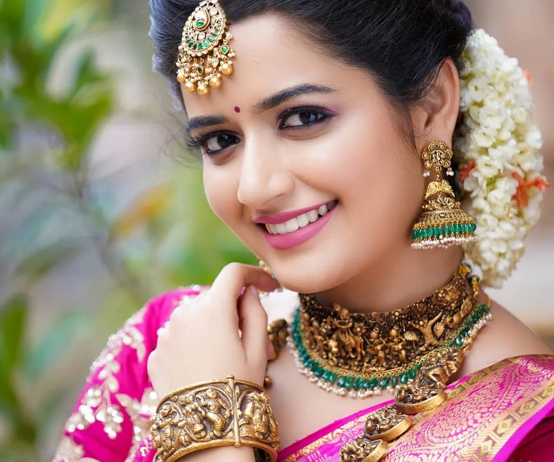 A perfect example of a bridal or festive portfolio shot. The focus here is on the details: the intricate temple jewellery, the flawless makeup, and the genuine, radiant smile. I use soft lighting to create a warm, flattering glow that makes the subject shine.