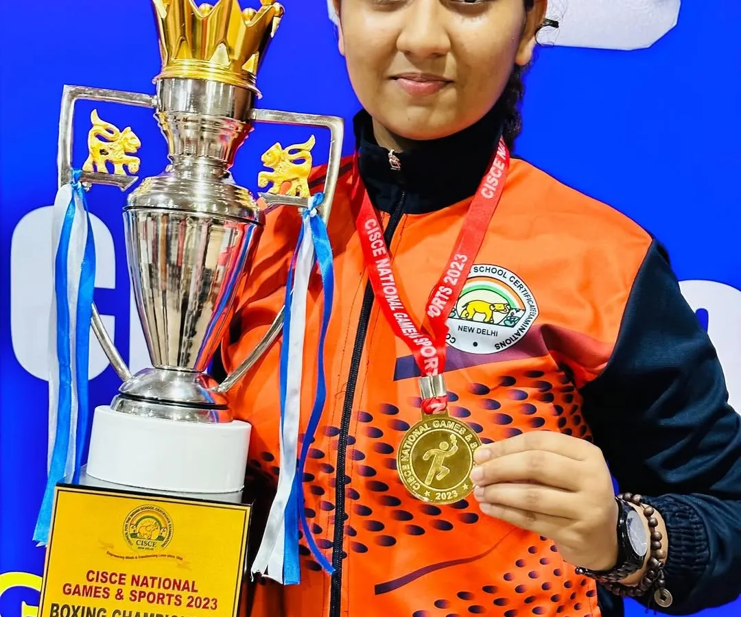 We don't just train, we build champions. Here is our star boxer, Prisha Pawar, with her gold medal and trophy from the CISCE National Games & Sports 2023, a testament to her hard work and our dedicated coaching.