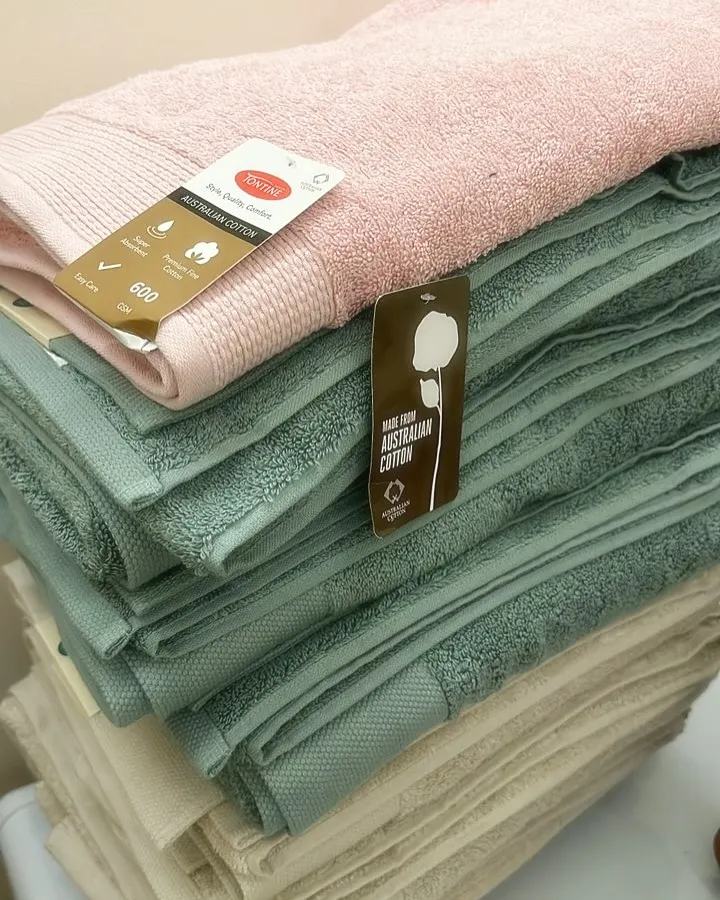 A stack of plush Australian cotton bath sheets I sourced. I personally check the quality to make sure they are thick, super absorbent, and come in beautiful, calming colours for your bathroom.