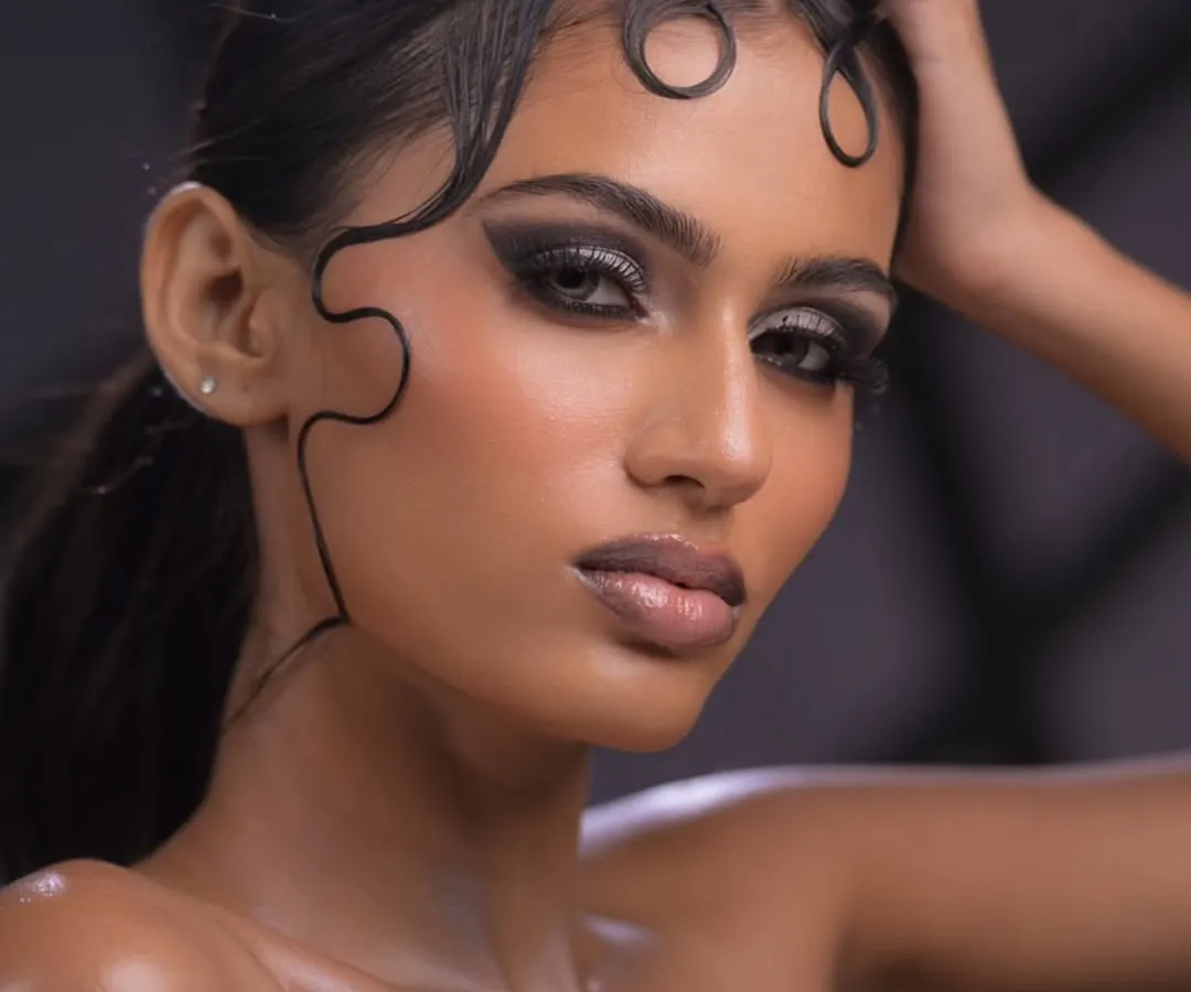 In my editorial module, you will learn to push creative boundaries. This look focuses on advanced techniques like creating a sculpted wet-look hairstyle and a dramatic, glossy smokey eye that's ready for a magazine cover.