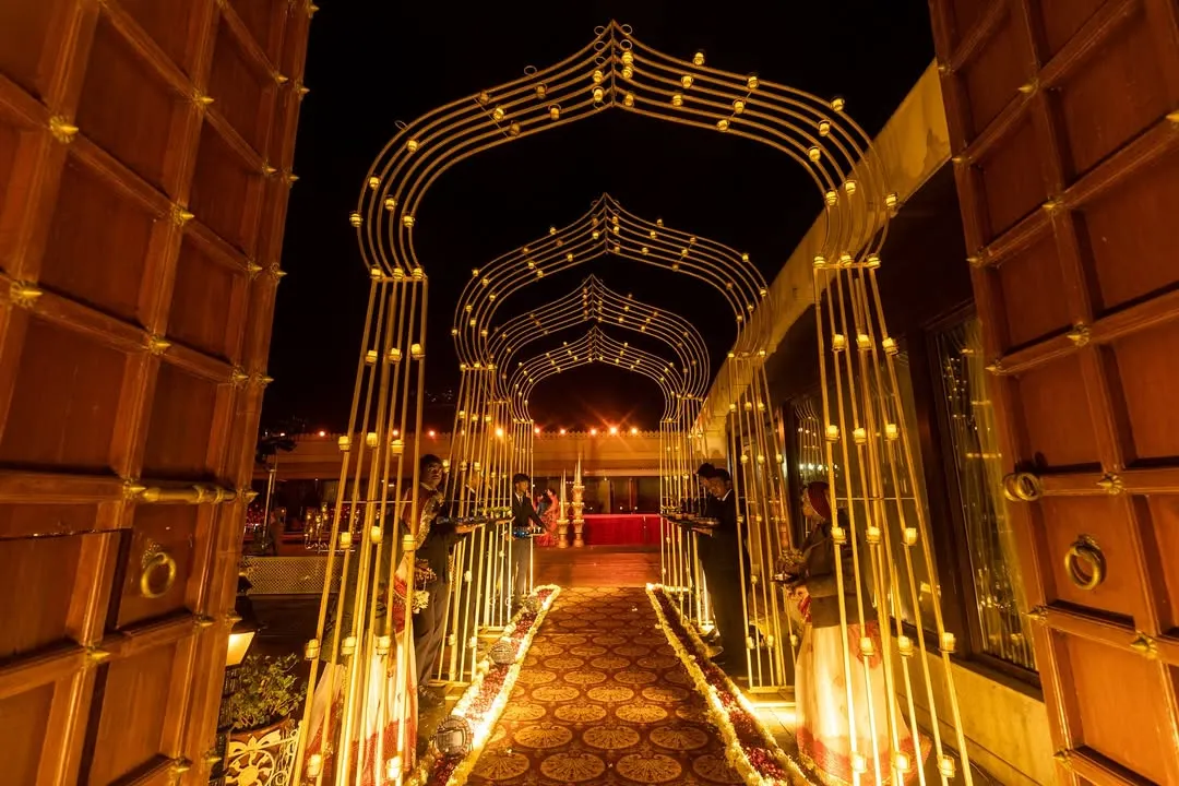 I believe a grand entrance sets the tone for the entire celebration. This illuminated arched walkway was designed to make guests feel like they were stepping into a different world, a signature touch in my luxury wedding decor services.