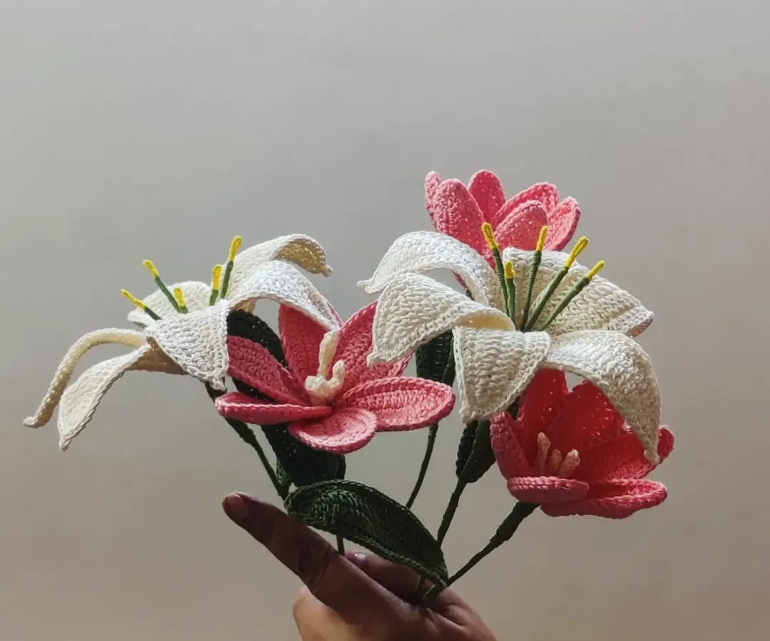 A beautiful, handcrafted bouquet of crochet lilies and tulips. These everlasting flowers are a perfect, sustainable gift that captures the beauty of fresh blooms without ever fading.