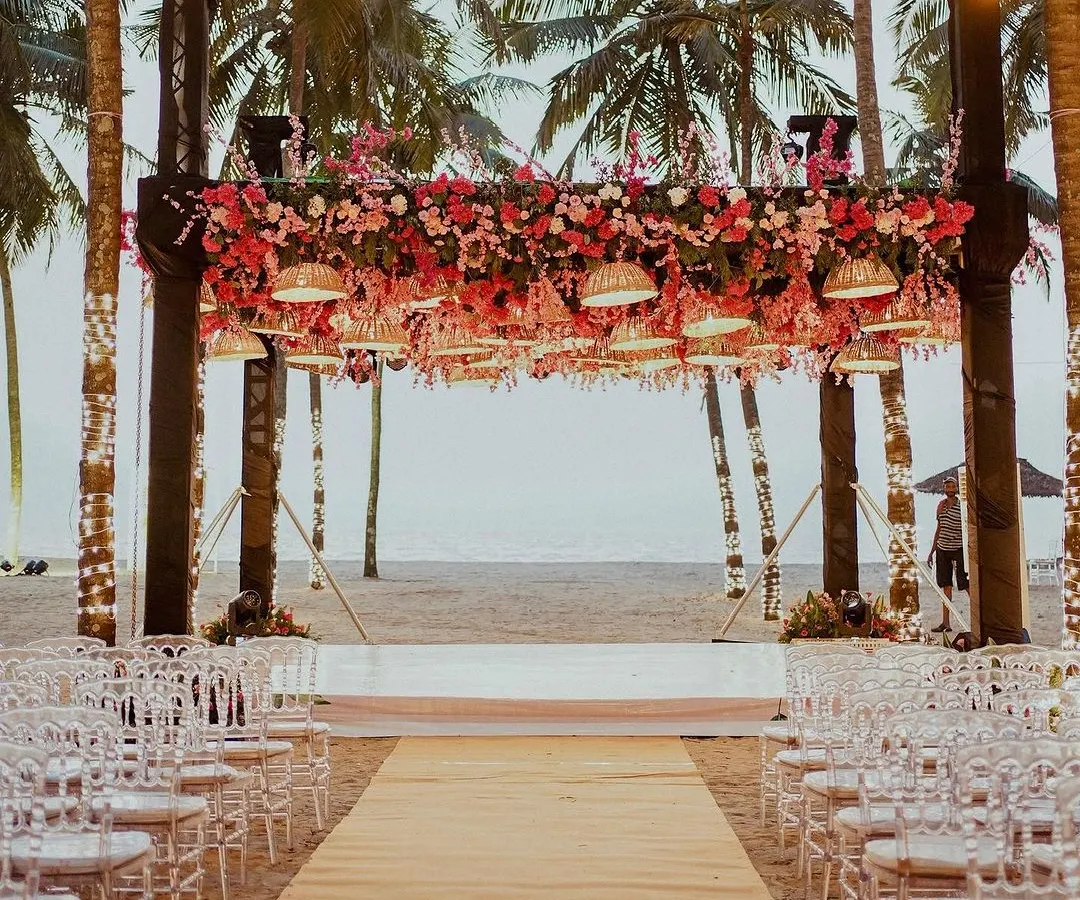 This is what dream beach weddings are made of. I designed this mandap on the sand, using woven lamps and lush pink florals to complement the natural beauty of the Kerala coastline, with the ocean as the ultimate backdrop.
