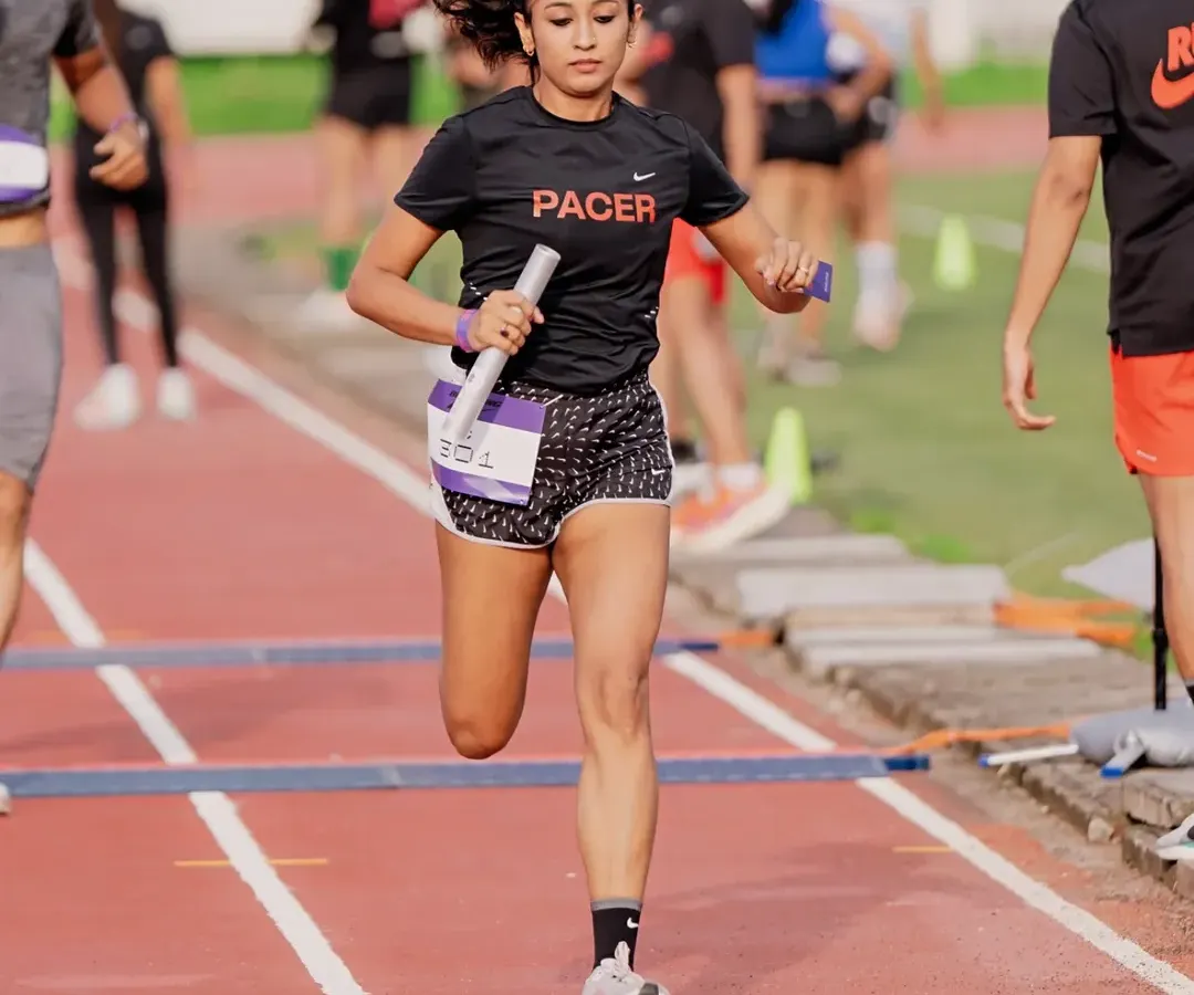 Speed and focus in the heat of competition. A track relay isn't just about running fast, it's about precision and teamwork. My coaching sharpens your explosive power for moments just like this.