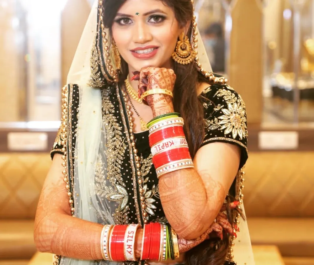 For her reception, we went with a glamorous look that was both traditional and modern. The makeup was designed to last through the night of celebrations while looking flawless in photos.