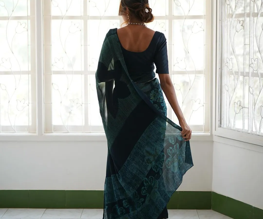 This is our hero item. The Nilā saree embodies our craft. It is a deep indigo silk georgette piece that took over 60 hours to create, combining intricate textures and custom-carved floral motifs using a specialized discharge printing technique.