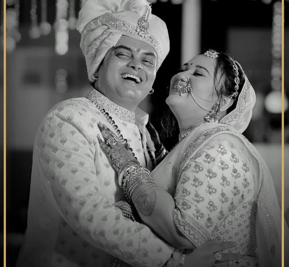 There's nothing more rewarding than seeing a groom beaming on his wedding day. Here, our client Mihir looks joyous and regal in a custom-designed off-white sherwani, perfectly capturing the happiness of the moment.