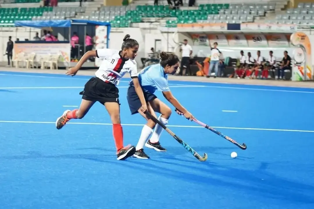 Intense one on one action during the Khelo India Women's Hockey League. My players are trained to be aggressive on the ball and relentless in their pursuit of victory, seen here in a tough tackle.
