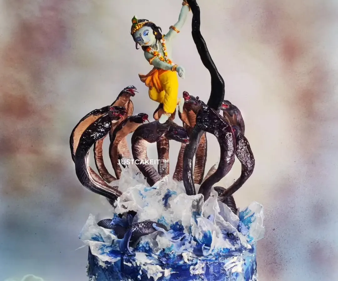 My award-winning 'Krishna dancing on Kaaliya Naag' cake is a piece of devotional art. The entire dynamic scene, including Krishna's pose and the splashing water of the Yamuna, is hand-molded and painted to capture a divine moment.