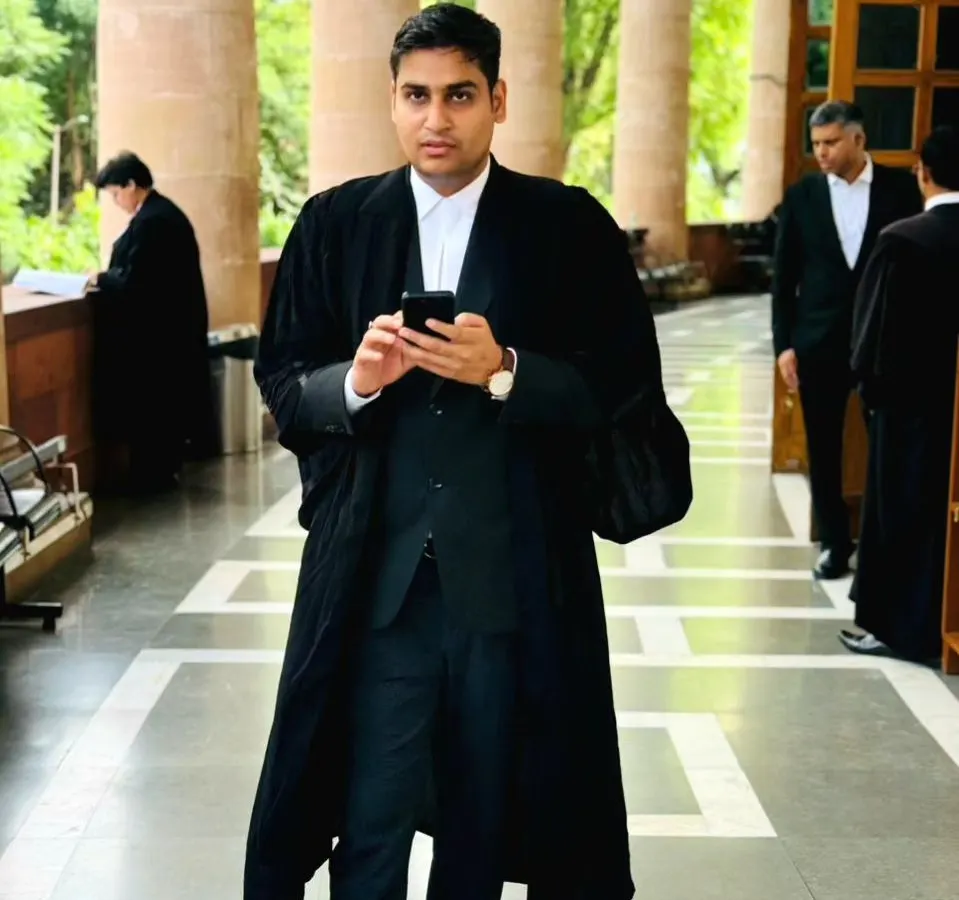 In the corridors of the court, dressed in my advocate's robes. This is my everyday environment, where I navigate the legal system to represent your interests effectively.