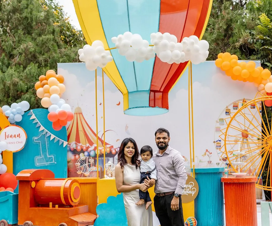 This vibrant carnival-themed first birthday party features a custom hot air balloon backdrop and a miniature train for the kids. It’s a perfect example of how I combine large-scale decorations with interactive elements for a fun-filled day.