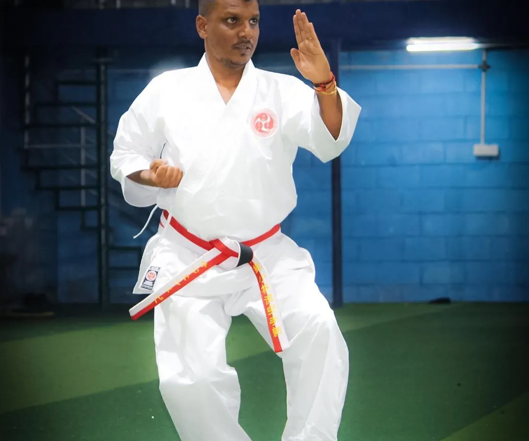 As your personal instructor, I demonstrate the precise form and posture required in Okinawa Shorin-Ryu Karate. This stance, a foundational element of our training, builds balance, stability, and power from the ground up.