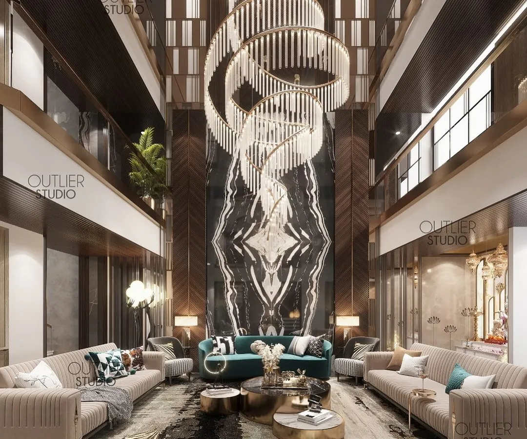 I designed this triple-height living room to be an unforgettable experience of scale and luxury. The soaring book-matched marble wall and the custom spiral chandelier create a dramatic focal point, demonstrating how I use vertical space to craft truly breathtaking interiors.