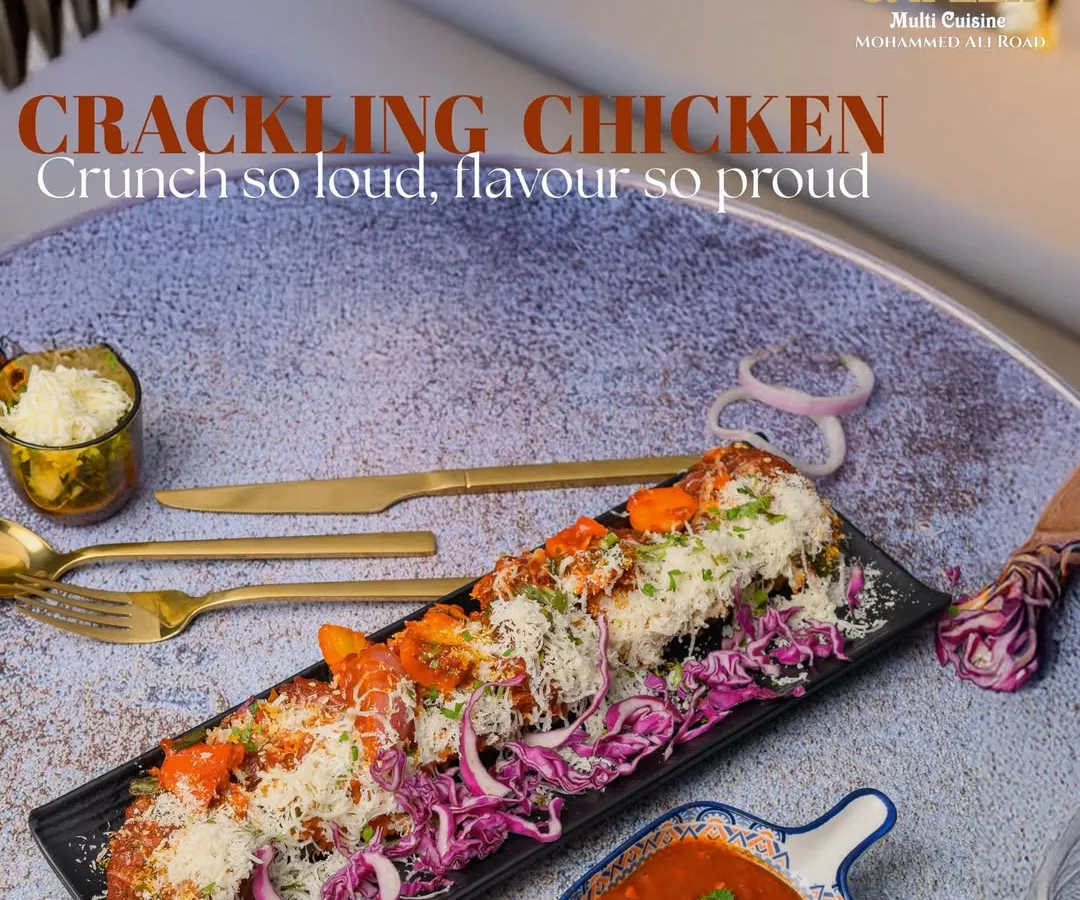 Our Crackling Chicken is a house favorite, known for its incredibly crunchy exterior and tender, juicy chicken inside. Served on a bed of crisp shredded cabbage and topped with grated cheese, it's a textural and flavorful starter perfect for any occasion.