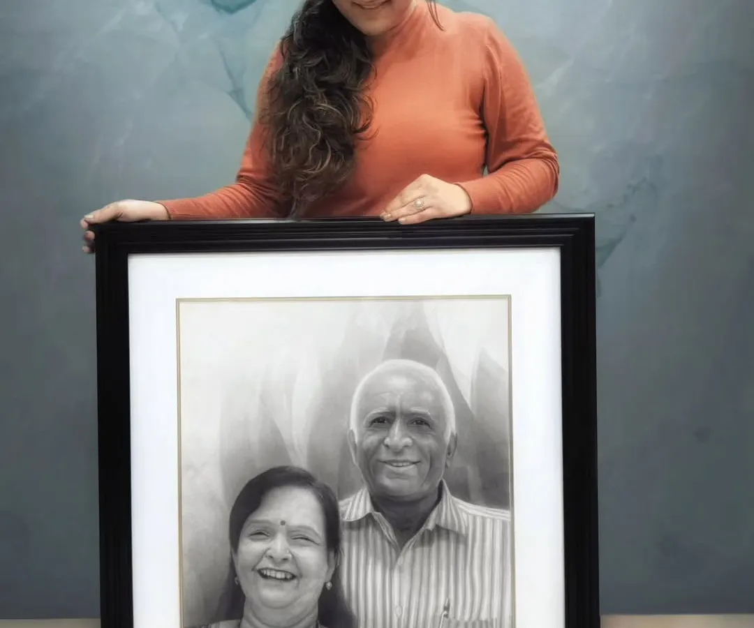 This is the finished portrait of my Naana and Naani, which I named "Laadvo". It's a hand-drawn family portrait created with graphite and charcoal on high-quality Fabriano paper to ensure it lasts for generations. Each line is filled with love and memories.