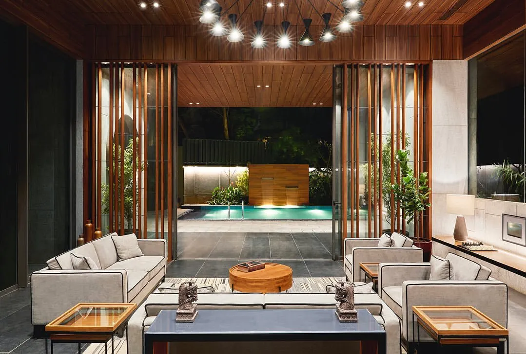 We designed this garden lounge for The Bandra Project to seamlessly connect indoor luxury with serene outdoor living, creating a private, versatile space for residents that opens directly to a leisure pool.